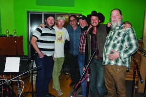 (From left): Bassist Jeff Brown, keyboard player Claude Bernard, Lagunitas Brewing Co. rep Jim Jacobs, drummer Keith Langford, Evan Felker, and Kevin Russell. (Photo by Brian T. Atkinson)