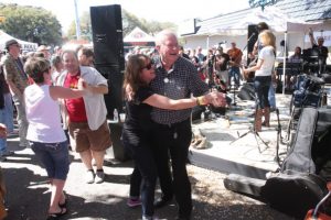 Fans dancing to Kelly Willis and Bruce Robison at the Lone Star Music/Freebirds free day stage at St. Vincent de Paul. (Photo by John Carrico)