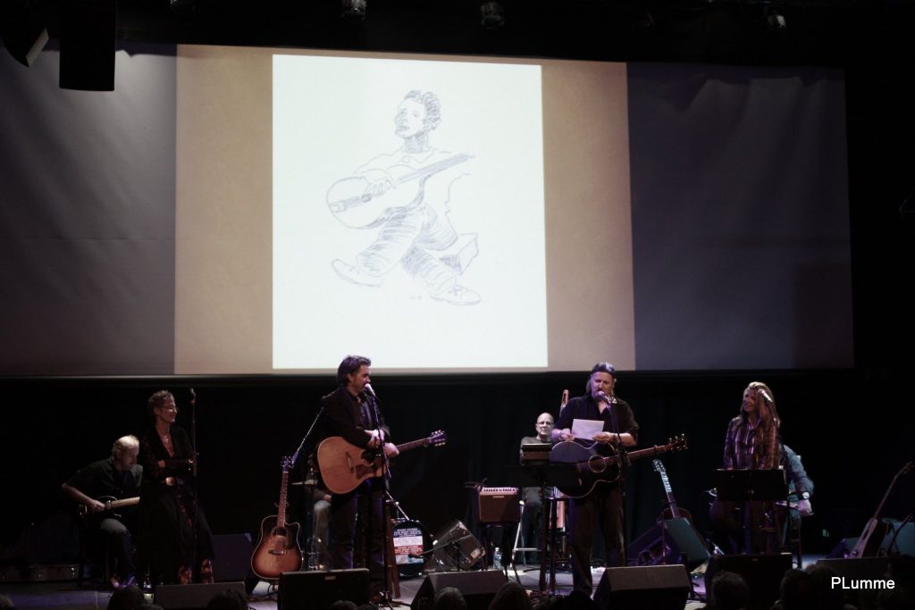 What would Woody do? Eliza Gilkyson, Slaid Cleaves, Jimmy LaFave, and Terri Hendrix present “Walking Woody’s Road” at Austin’s One World Theatre. (Photo by Patricia Lumme) 