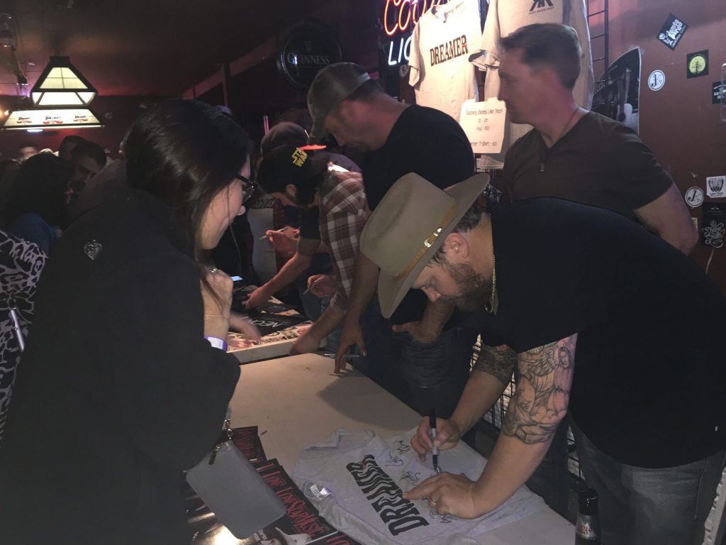 The Randy Rogers Band signing autographs at their "Nothing Shines Like Neon" release party at Cheatham Street Warehouse. (Photo by Richard Skanse)